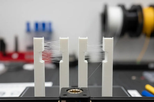 retraction test print showing stringing vs clean results — Forgely guide